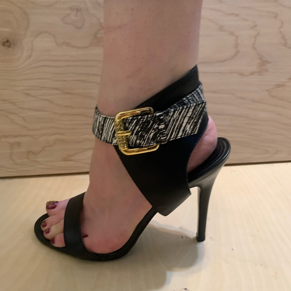 Gorgeous pair of Guess heels. Size 7 1/2. Ankle strap in black and white.